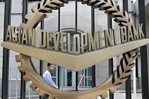 a worker walks past inside the asian development bank adb headquarters in manila june 17 2009 photo reuters
