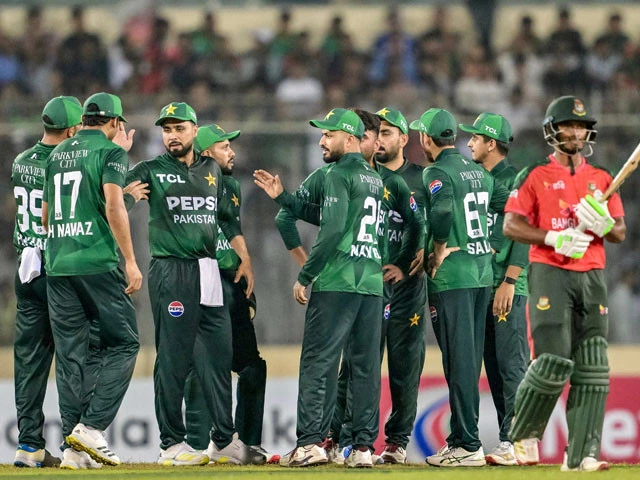 pakistan s players celebrate as bangladesh s tanzid hasan r walks back to the pavilion after his dismissal during the first twenty20 international cricket match between bangladesh and pakistan at the sher e bangla national cricket stadium in dhaka on july 20 photo afp