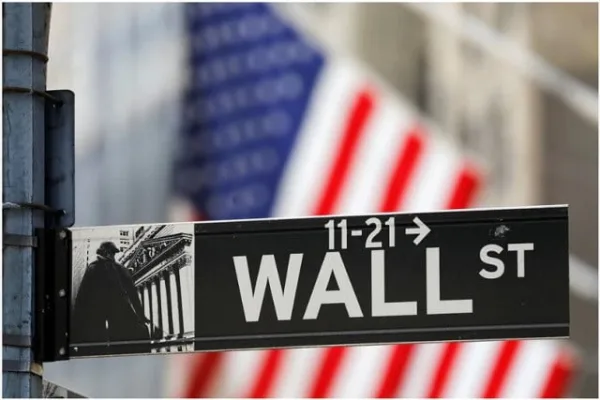 a street sign for wall street is seen outside the new york stock exchange nyse in new york city new york us july 19 2021 photo reuters