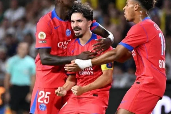 vitinha c celebrates with teammates nuno mendes and desire doue after scoring paris saint germain s winning goal against nantes photo afp