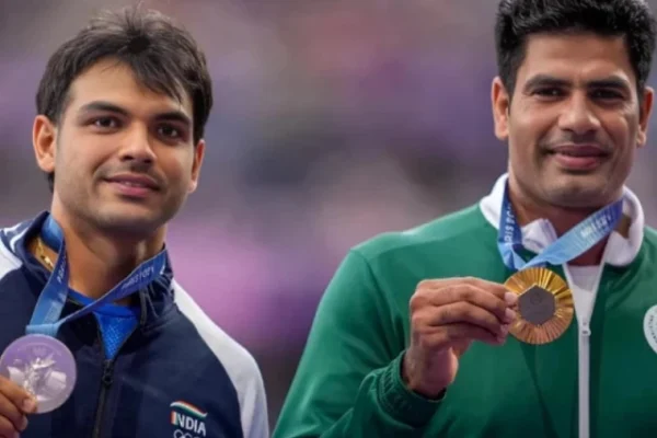 gold medallist arshad nadeem of pakistan celebrates with his medal on the podium with silver medallist neeraj chopra of india at stade de france on august 9 2024 photo reuters file