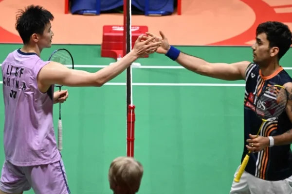 china s li shifeng l is congratulated by india s lakshya sen after winning their men s singles final match during the hong kong open photo afp