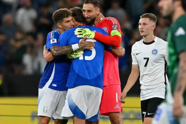 italy s goalkeeper 01 gianluigi donnarumma c italy s forward 15 pio esposito 2l and italy s defender 22 giovanni di lorenzo l embrace as they celebrate their team s victory at the end of the fifa world cup 2026 group i qualifiers photo afp