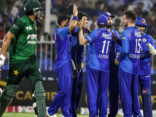 afghanistan s players celebrate after taking the wicket of pakistan s harris rauf l during the t20 international cricket match between afghanistan and pakistan in sharjah on september 2 2025 photo afp