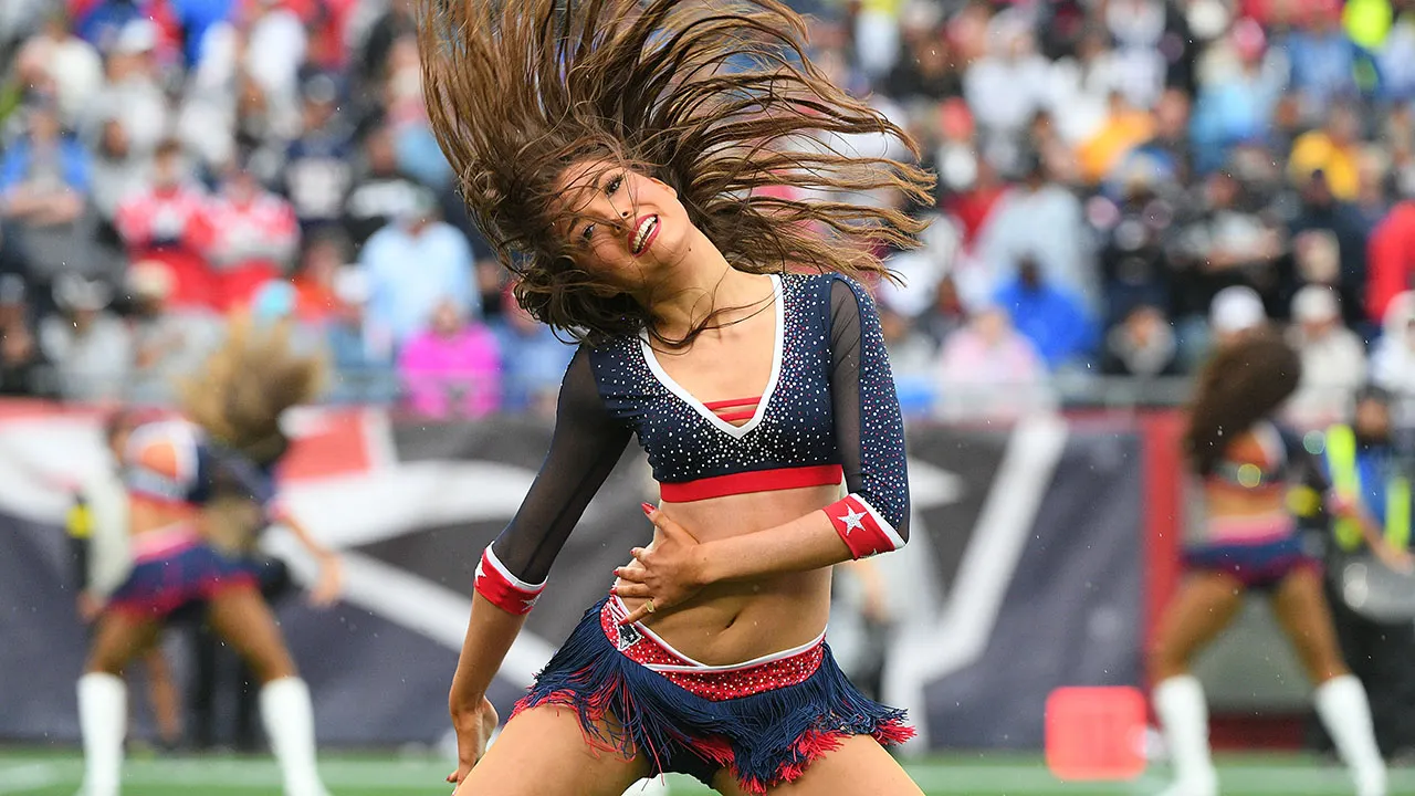 A cheerleader during the Raiders-Patriots game