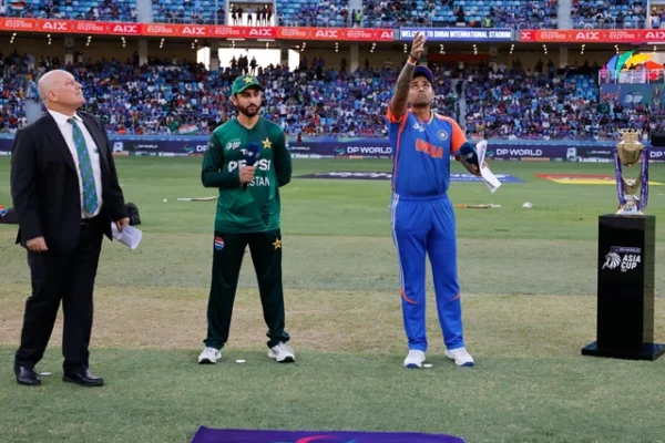 indian captain suryakumar yadav tosses the coin as pakistan skipper agha salman looks on ahead of the highly anticipated asia cup 2025 clash between india and pakistan at the dubai international stadium photo x