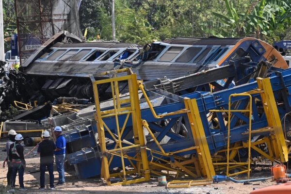 Crane falls onto moving train in Thailand, killing at least 29 in fiery derailment