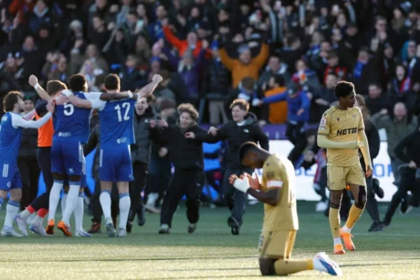 crystal palace s marc guehi looks dejected as macclesfield f c players celebrate after the match photo reuters