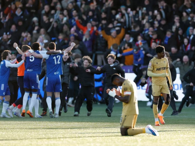 crystal palace s marc guehi looks dejected as macclesfield f c players celebrate after the match photo reuters