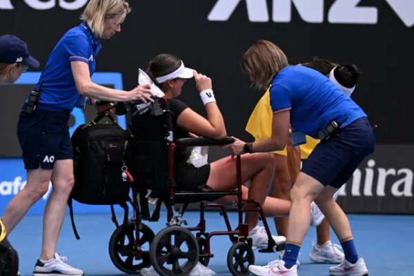 canada s marina stakusic is assisted onto a wheelchair after retiring from her first round match against australia s priscilla hon photo reuters