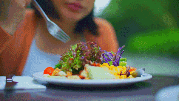 Woman eating healthy salad