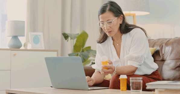 Woman on her computer shopping for prescriptions