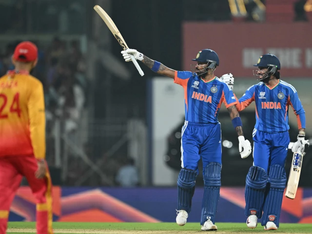 ndia s hardik pandya c celebrates after scoring his half century 50 runs as teammate tilak varma r looks on during the 2026 icc men s t20 cricket world cup super eights match between india and zimbabwe at the ma chidambaram stadium in chennai on february 26 2026 photo afp