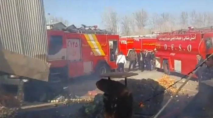 Iranian military helicopter crashes into fruit market, four dead