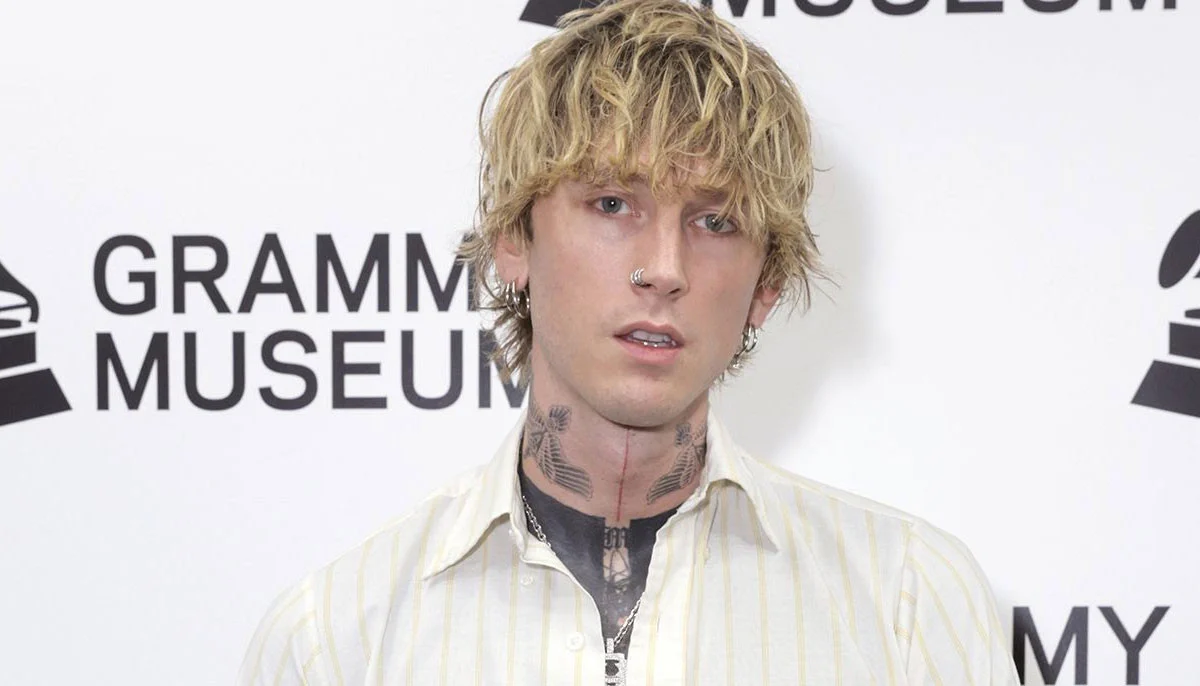 Machine Gun Kelly unveils new ear ink at Grammys pre-party
