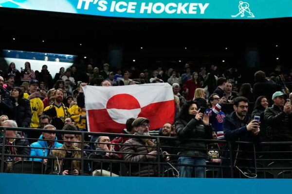 Olympic hockey fans raise Greenland's flag during USA's dominant win over Denmark, sparking viral reaction