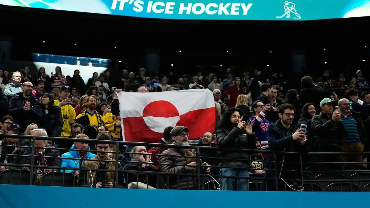 Olympic hockey fans raise Greenland's flag during USA's dominant win over Denmark, sparking viral reaction