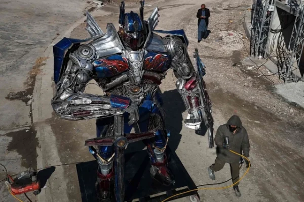 sculptor ehtisham jadoon working on a model of optimus prime a film character from transformers made from scrap metal at his studio on the outskirts of islamabad photo afp