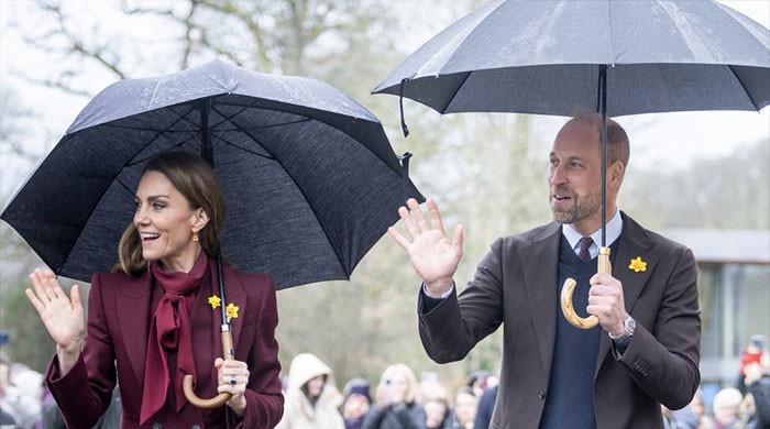 Prince William and Kate's rainy visit finds Aston Villa waiting