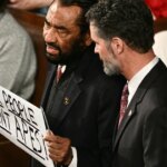 Rep. Al Green ejected from Trump's State of the Union after holding a 'Black people aren't apes' sign