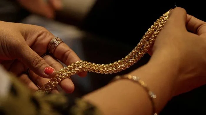 Shining gold, nervous economy