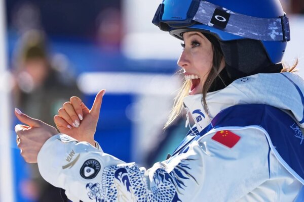Skier Eileen Gu sports a personalized, detail-studded ski suit at Milano Cortina Olympics