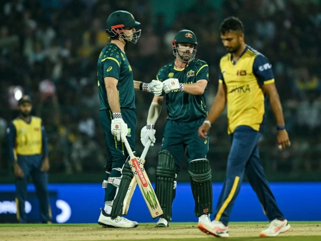 australia s captain mitchell marsh l and travis head c bump their fists during the 2026 icc men s t20 cricket world cup group stage match between australia and sri lanka at pallekele international cricket stadium in kandy on february 16 2026 photo afp