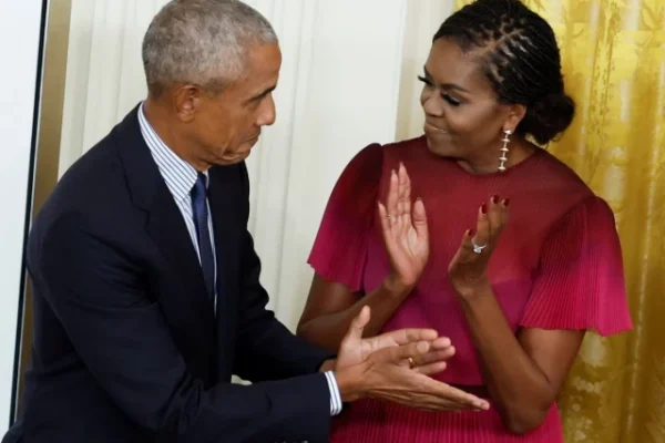 former president barack obama and former first lady michelle obama react during the unveiling of their official white house portraits in the east room of the white house in washington september 7 2022 photo reuters