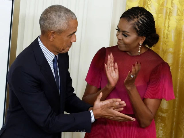former president barack obama and former first lady michelle obama react during the unveiling of their official white house portraits in the east room of the white house in washington september 7 2022 photo reuters