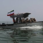 Cargo ship struck by a projectile in the Strait of Hormuz, UK says