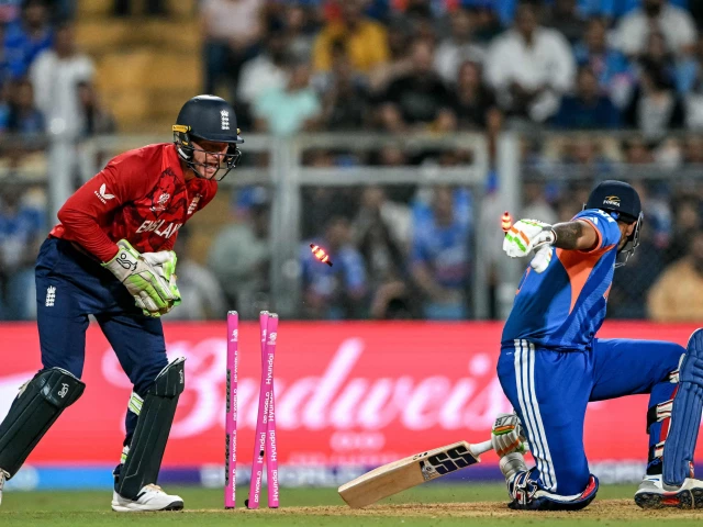 england s wicketkeeper jos buttler stumps out india s captain suryakumar yadav during the 2026 icc men s t20 cricket world cup semi final match between india and england at the wankhede stadium in mumbai on march 5 2026 photo afp