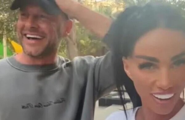 Katie Price laughs off pregnancy claims as Lee Andrews remains overseas