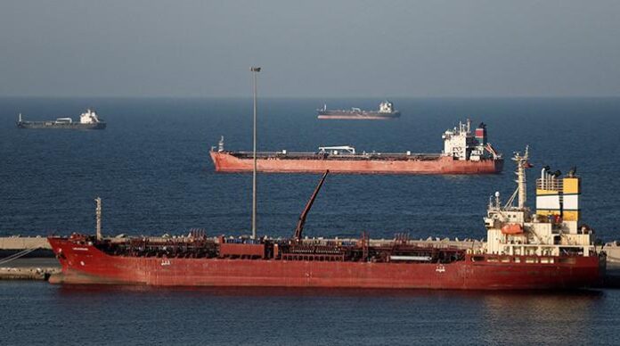 Oil hovers around $100, stocks mixed as Iran war rages