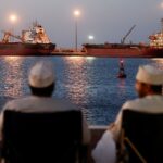 Oil prices fall below $100 per barrel on possible stockpile release to address supply disruption