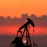 Oil prices hover around $90 a barrel in volatile trading following Monday's spike