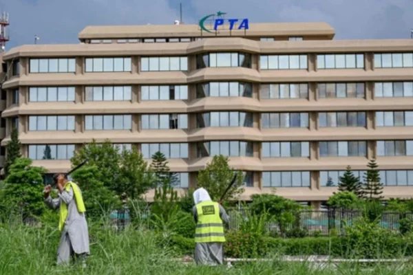 people work near the pakistan telecommunication authority pta headquarters building in islamabad on august 16 2024 photo afp
