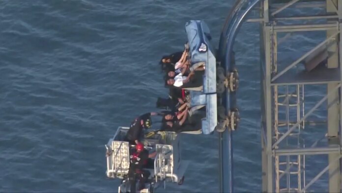 Eight riders left dangling atop 100-foot roller coaster for over three hours at Texas amusement park