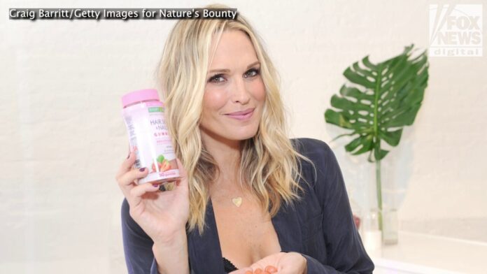 Molly Sims puts on a bikini and gets in the sand to dunk on those who told her modeling wouldn't last forever