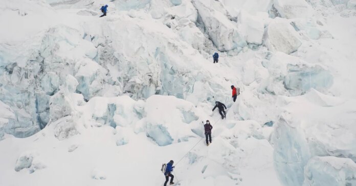 Mount Everest record set as 274 climb Nepal's side of world's highest peak in single day