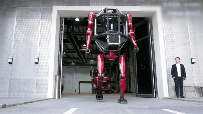 Unitree’s GD01 rideable robot is pictured towering over a person