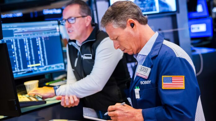 Stocks close at record highs with tech leading the way again. Nasdaq gains 8% in May