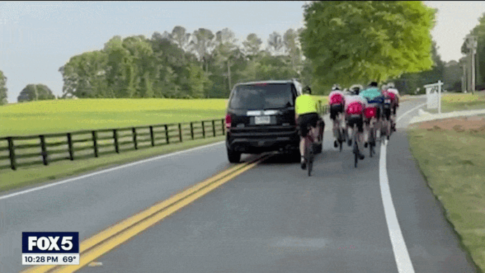 GIF of SUV hitting cyclist