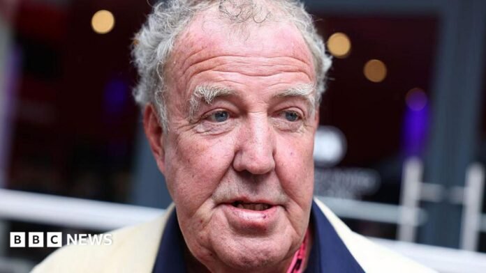 A closeup of TV presenter Jeremy Clarkson with grey hair and eyebrows looking to the right. 