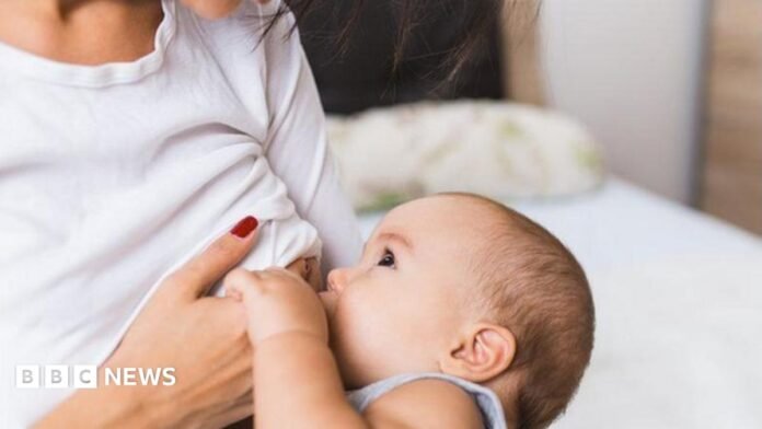 A stock image of a woman breastfeeding a baby