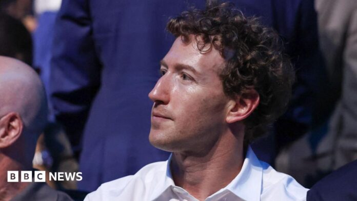 Mark Zuckerberg, wearing a white collared shirt while sitting in a crowd at the recent UFC event at the White House. 