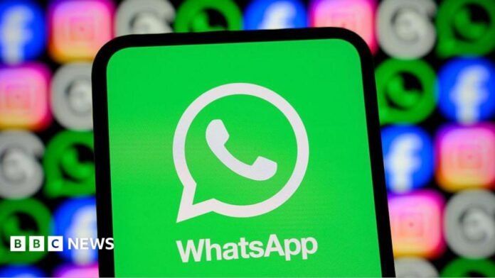 WhatsApp logo displayed on a smartphone screen, with its logo shown alongside those of Meta apps Facebook, Instagram and Threads.