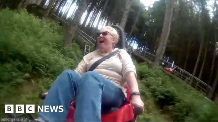 A woman looking excited on a woodland rollercoaster