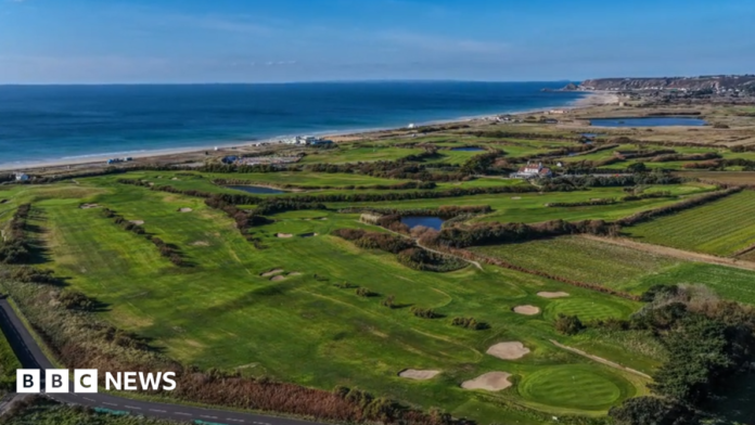An aerial view of the golf course at Les Mielles. The sea is visible in the background. 