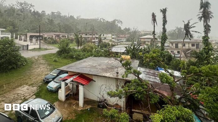 This picture shows a general view of a residential area as rain falls ahead of the arrival of the forecasted Super Typhoon Bavi in Saipan, Northern Mariana Islands, on July 5, 2026.