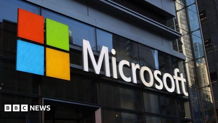 A Microsoft building with a sign bearing the company's logo